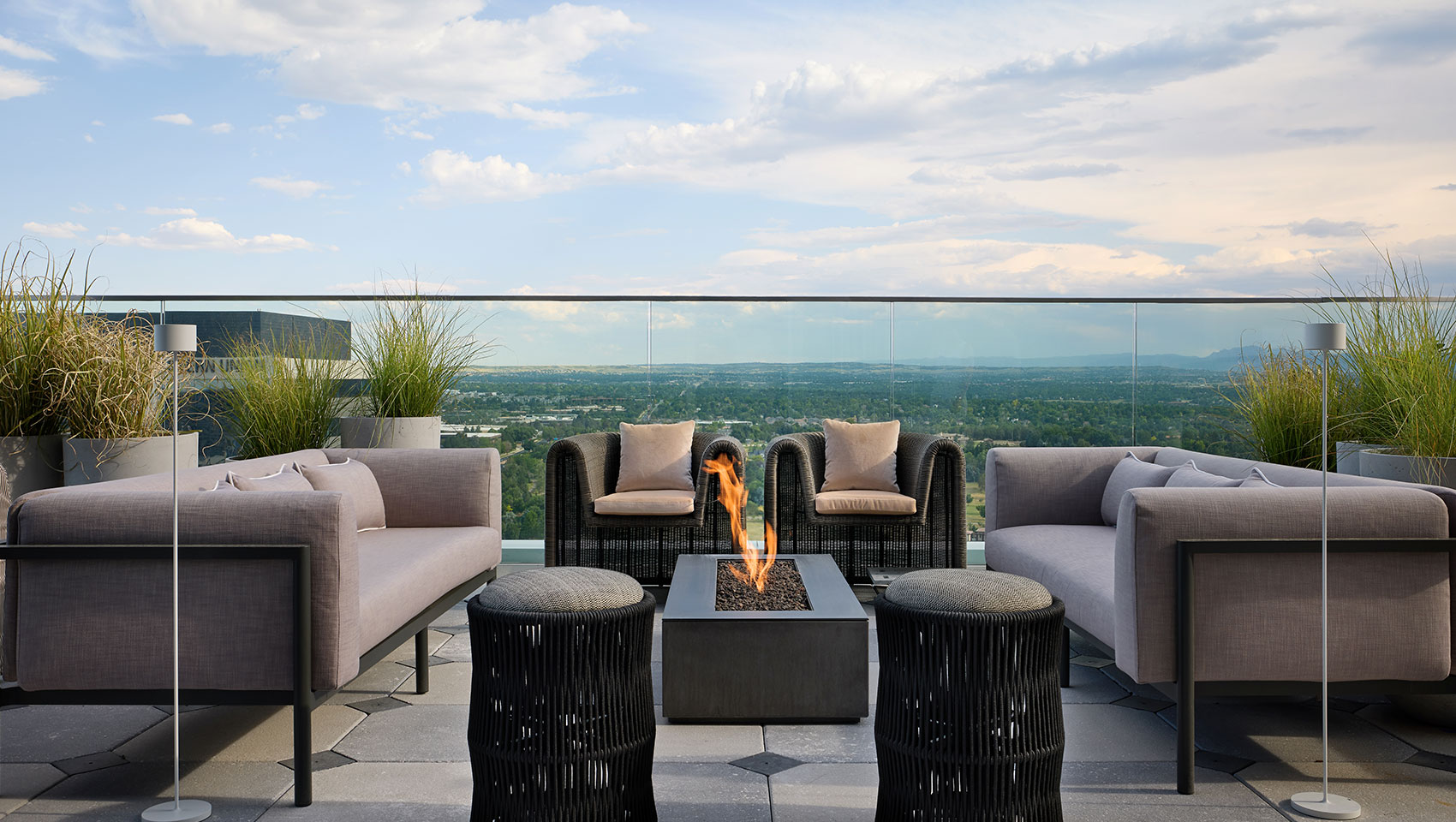 Halo Bar outdoor rooftop seating with firepit at Kimpton Claret Hotel