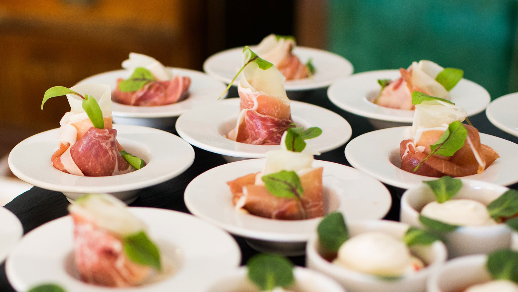 multiple bowls of proscuitto in bowls