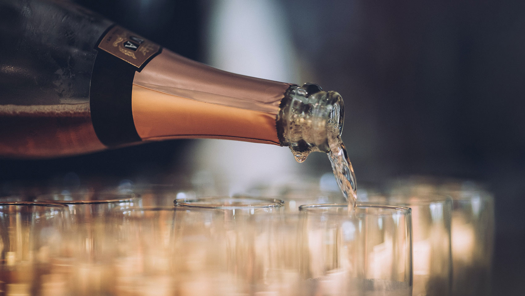 champagne being poured into glasses