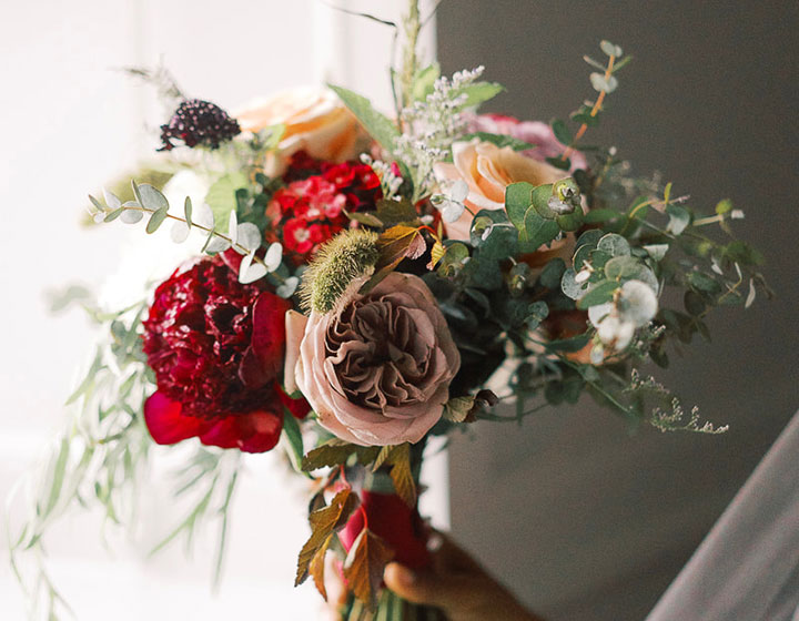hand holding a bouqet of flowers